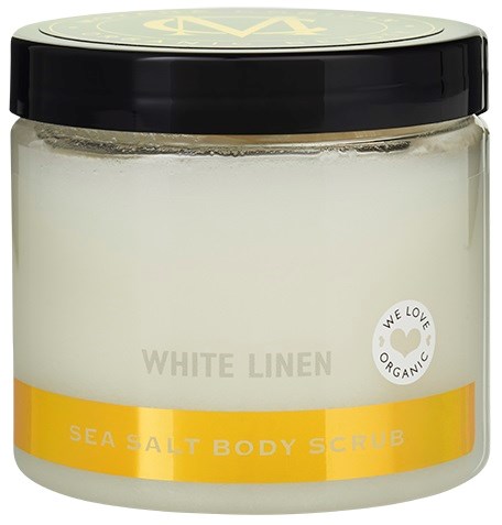 Et glass med hvit linhage salt kroppsskrubb med svart lokk og etikett som sier "White Linen" og "Sea Salt Body Scrub."