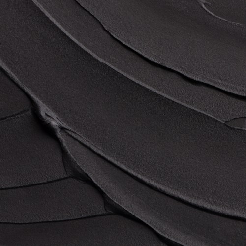 Close-up of black, layered, textured material with smooth, curved lines.
