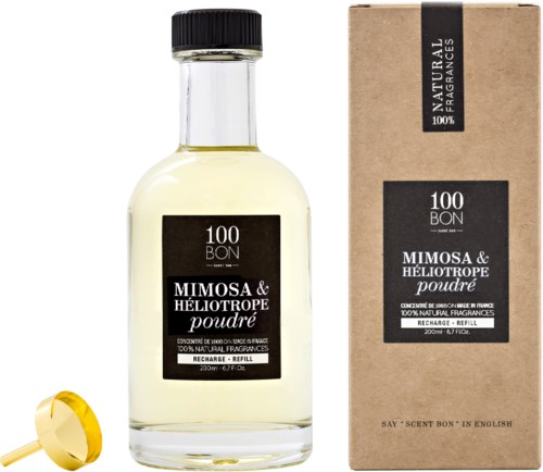 En parfymflaska med svart etikett och en kartong bredvid, båda märkta 'Mimosa & Héliotrope poudré'.