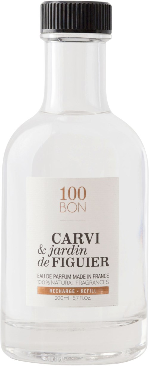 En genomskinlig flaska med svart lock, märkt med "100 BON" och doftdetaljer på franska.