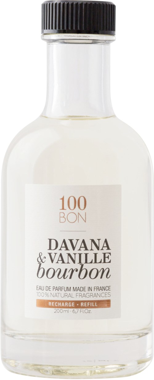 En liten klar glasflaska med svart lock, märkt "Davana & Vanille Bourbon" parfym, tillverkad i Frankrike, innehåller parfym.
