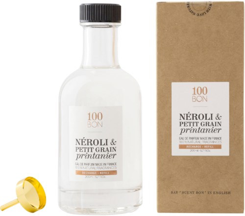 En klar parfymflaska med svart lock, bredvid en brun låda, båda märkta Neroli & Petit Grain printanier.