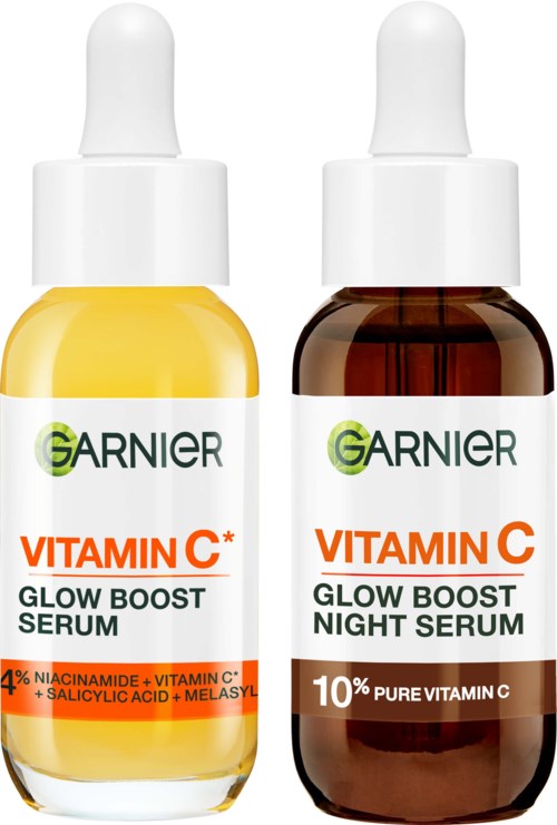 Two Garnier serums, one for brightening and one for night use, in small bottles with dropper caps.