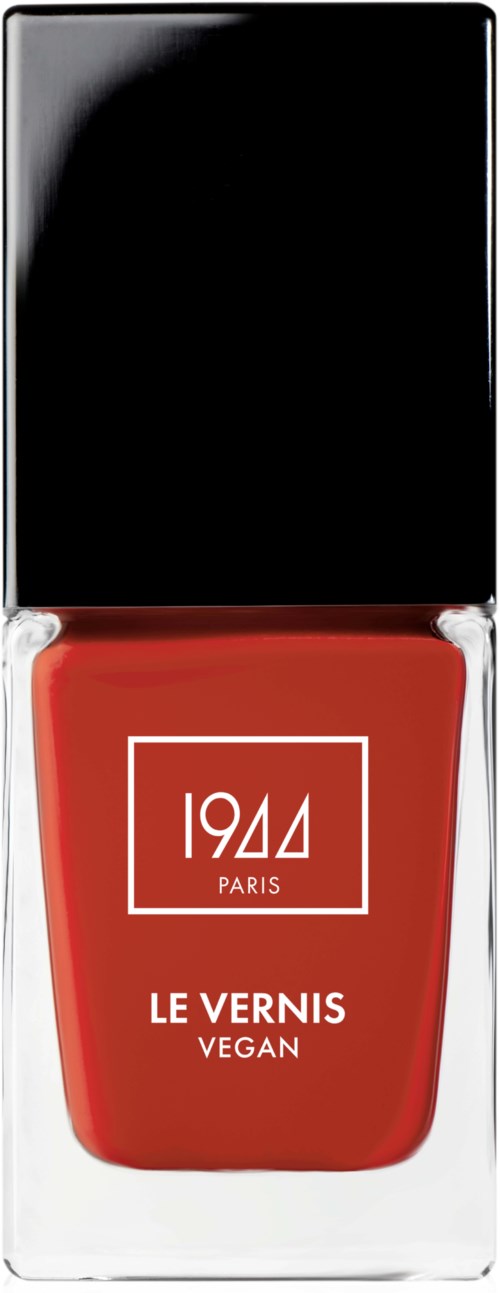 Röd nagellackflaska med svart lock, visar texten "1944 PARIS LE VERNIS VEGAN."