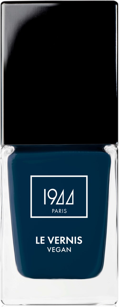 Mörkblå vegansk nagellack i en genomskinlig flaska med svart kork, märkt 1944 PARIS, LE VERNIS vegan.