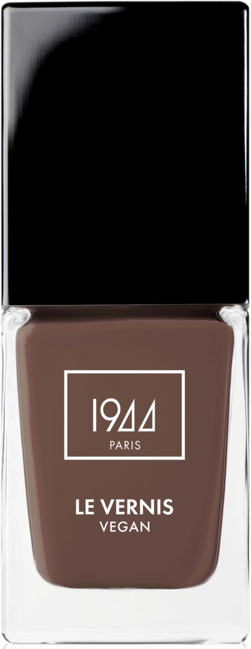 En vegansk nagellackflaska med svart kork, märkt "1944 PARIS LE VERNIS VEGETAL."