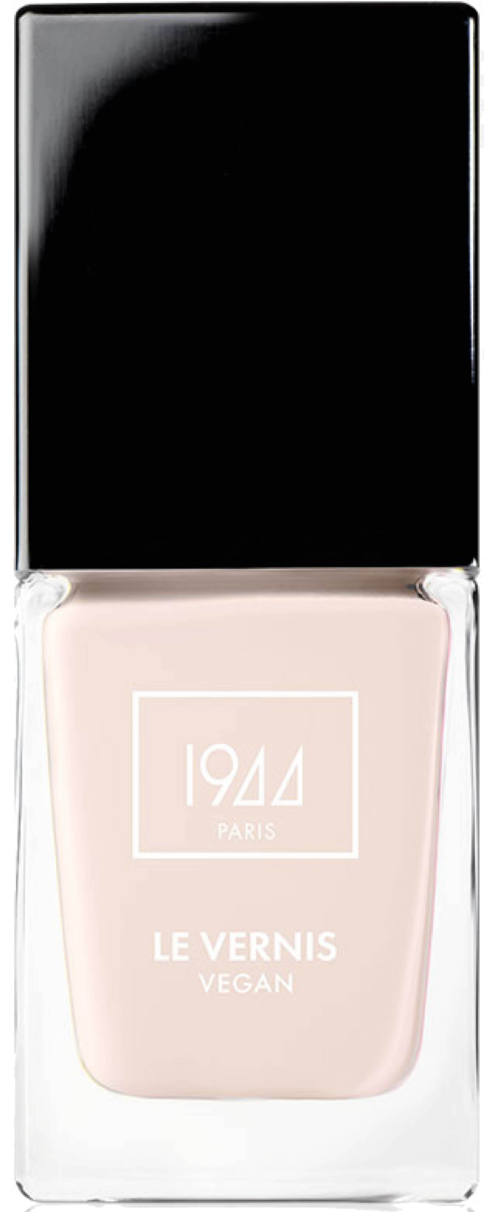 Ljusrosa nagellackflaska märkt '1944 Paris, Le Vernis Vegan' med svart lock.