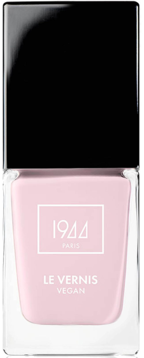 Ljusrosa nagellackflaska med svart lock, märkt '1944 PARIS LE VERNIS VEGAN.'