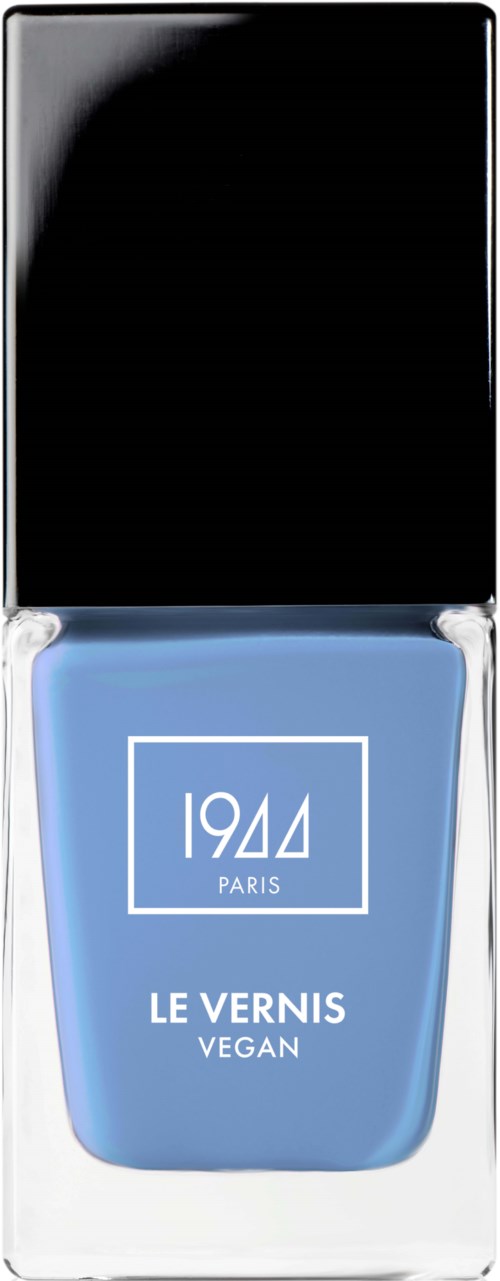 En ljusblå vegansk nagellackflaska med svart lock, märkt '1944 Paris'.