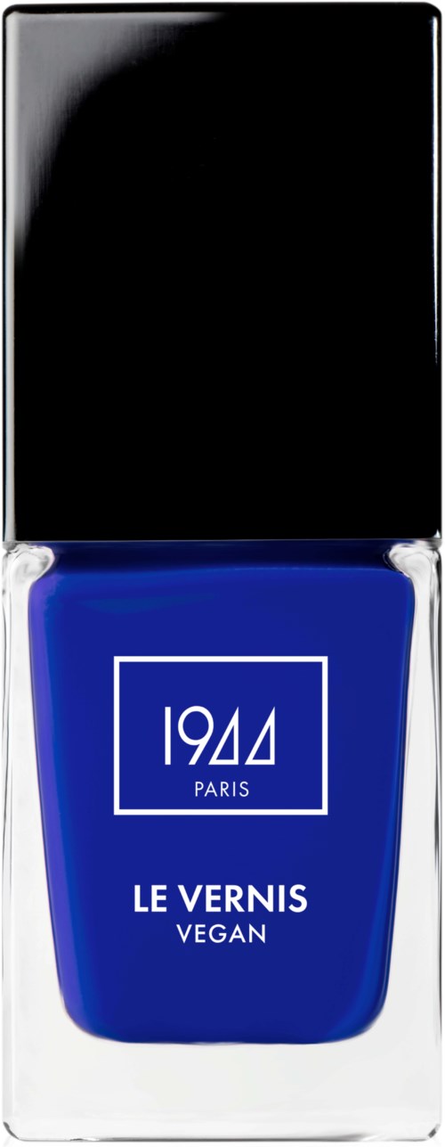 En blå vegansk nagellackflaska med svart lock, märkt '1944 Paris' och 'Le Vernis'.