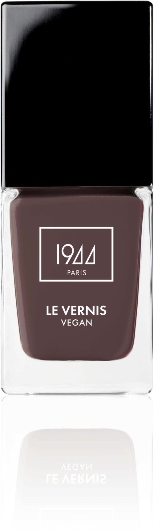 En vegansk nagellackflaska märkt '1944 Paris' med svart lock och lila lack inuti.