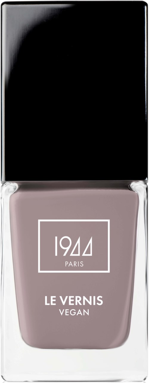 Veganskt nagellack i en ljus mauvefärg, i en svart och genomskinlig flaska med svart lock.