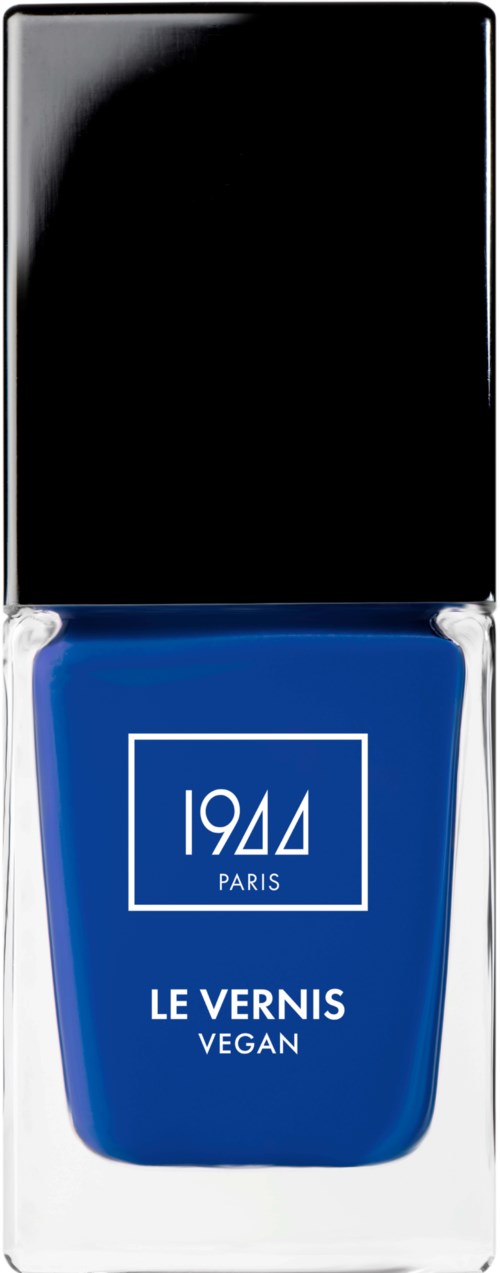Blå vegansk nagellacksflaska med svart kork, märkt "1944 PARIS LE VERNIS VEGAN."