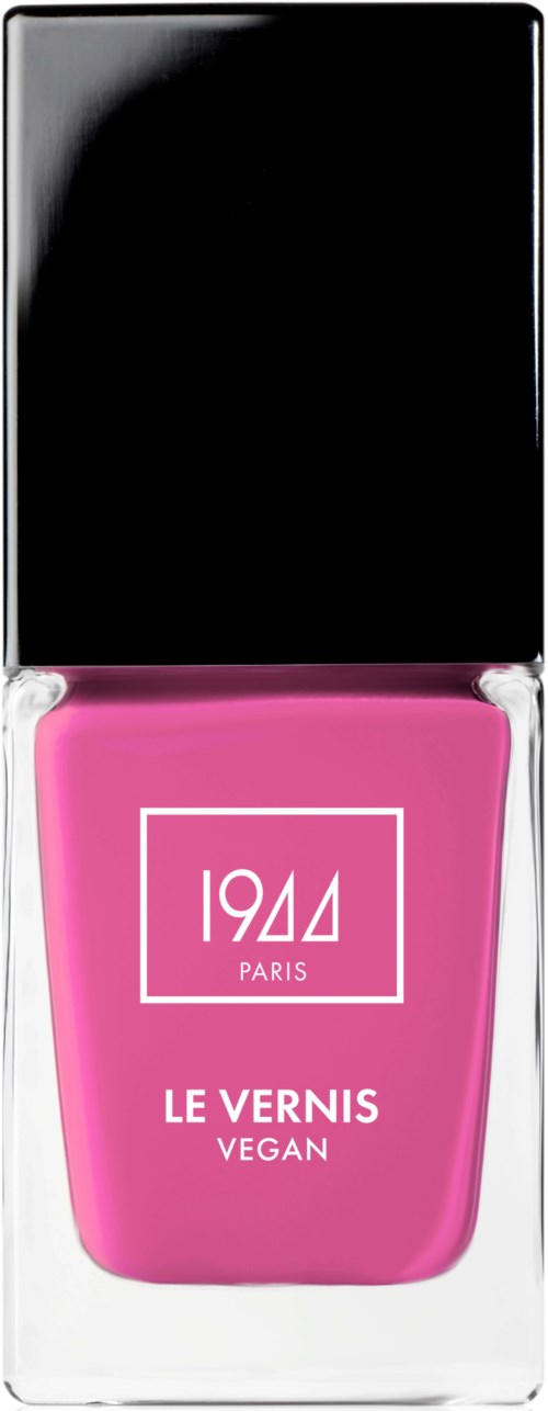 En rosa nagellackflaska med svart lock, märkt '1944 Paris,' 'Le Vernis Vegan,' inuti ett klart box.