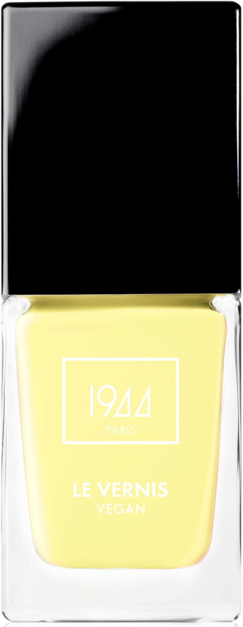 En gul vegansk nagellackflaska med svart lock, märkt '1944' och 'LE VERNIS'.