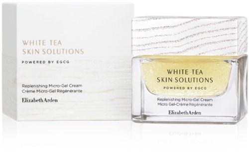 Ein Glas mit gelber Creme, Verpackung und Text für Elizabeth Arden's White Tea Skin Solutions Produkt.
