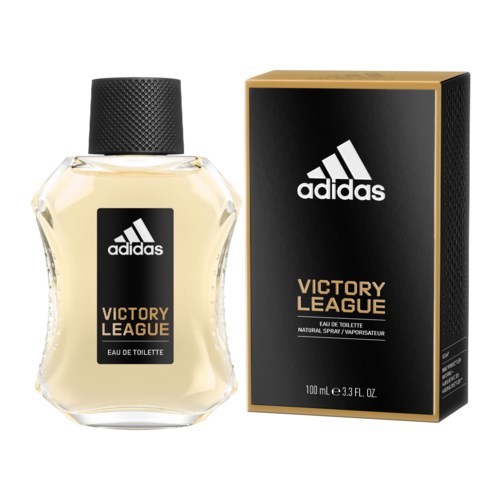 En flaska Adidas Victory League-parfym bredvid dess svarta och guldiga förpackning.