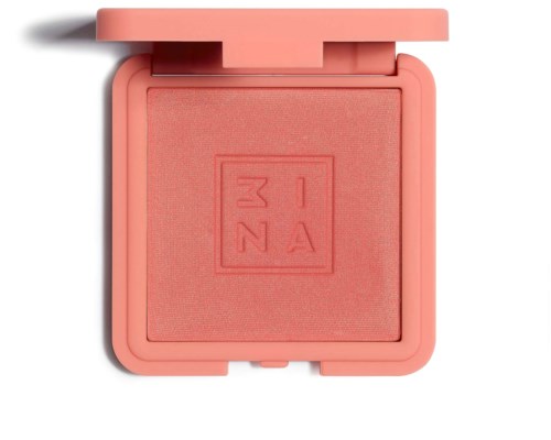 Et coral rosa blush-kompakt med et firkantet indpræget logo indeni, med åben låge og skygge.