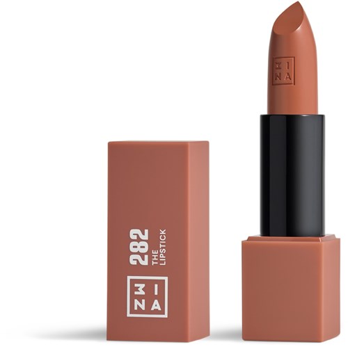 A lipstick with a black case and soft pinkish-brown color, standing next to a pink box with white text.
