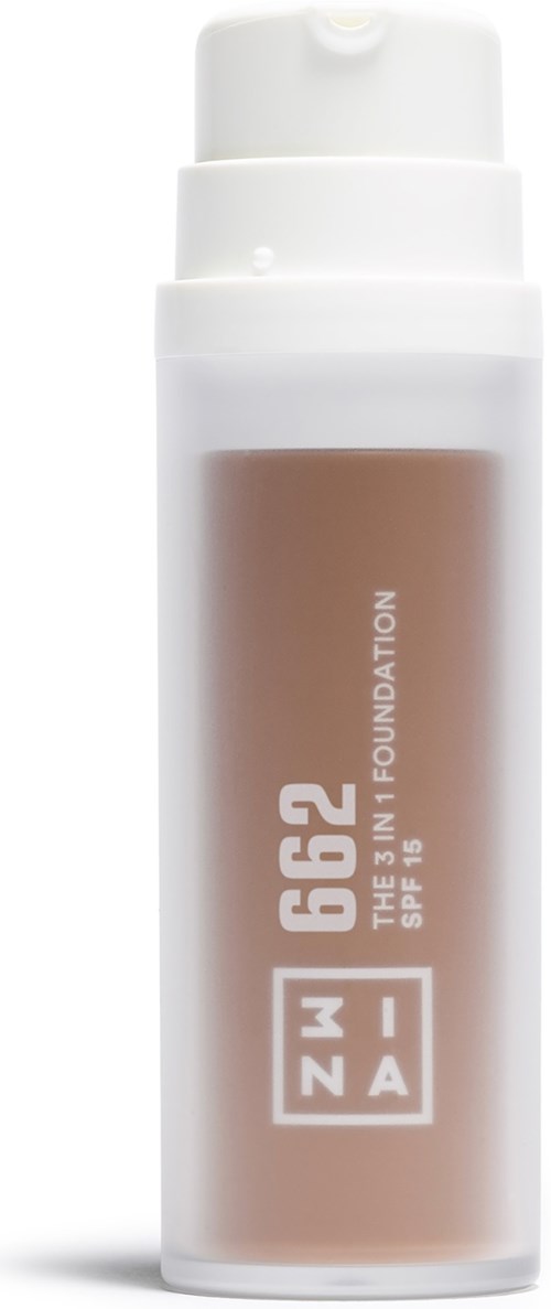 Butelka podkładu płynnego z SPF 15, oznaczona 'ZIAJA 662 THE 3 IN 1 FOUNDATION' z białą nakrętką.