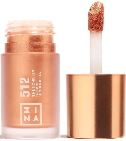 En rosa-beige flytende highlighter med en børstepinne og gullfarget lokk.