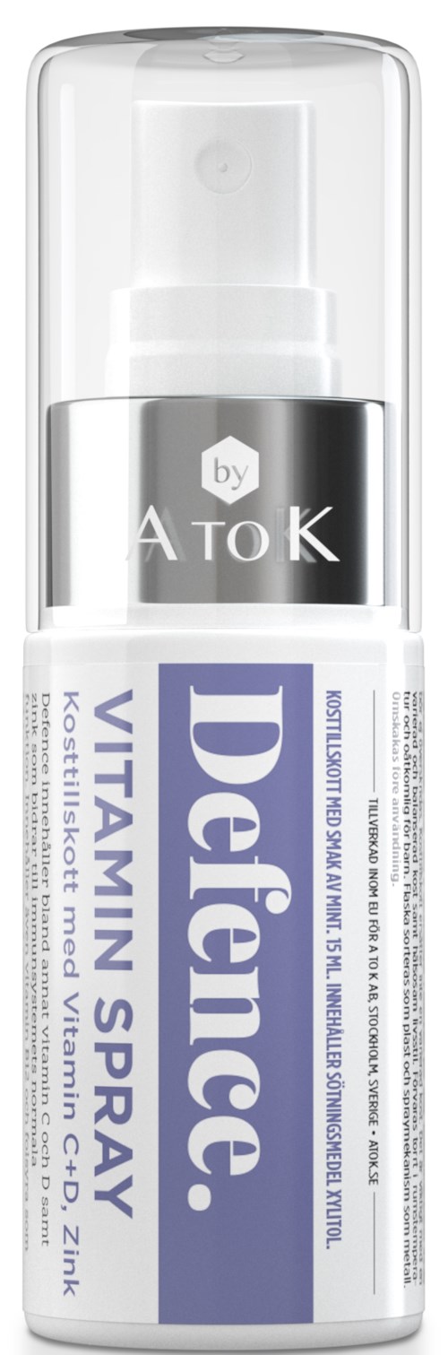 En liten vit flaska med klar pump, märkt 'Defence Vitamin Spray' för hudhydrering.