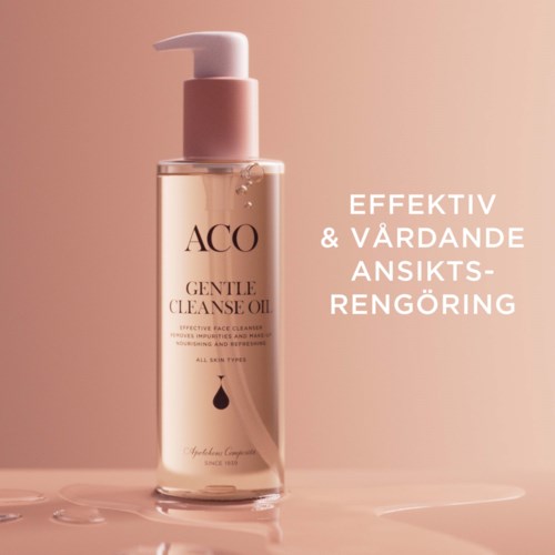 En tydlig flaska med mild ansiktstvättolja med pump, rosa etikett och text om effektiv ansiktsrengöring.