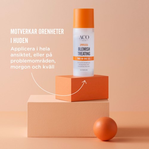 A skincare product labeled 'Blemish Treating' on an orange and pink display, with a round orange object nearby.