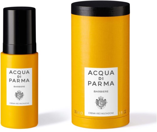 En gul flaska och en matchande gul cylindrisk förpackning med etiketter, delar av Acqua di Parma-serien.
