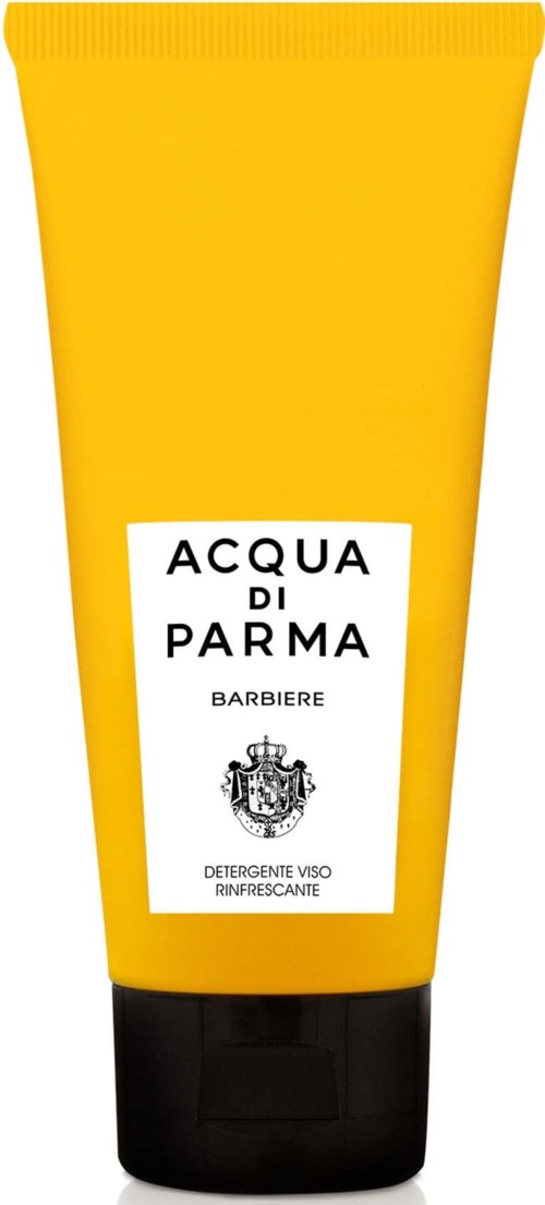 En gul tub med svart lock, märkt 'Acqua di Parma' och 'Barbiere', vilket tyder på att det är en ansiktstvätt.
