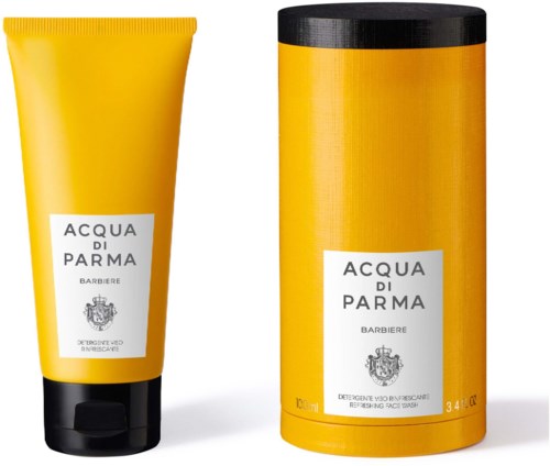 Gult lock och tub med Acqua di Parma Barbierie ansikts- och handtvätt med svarta lock.