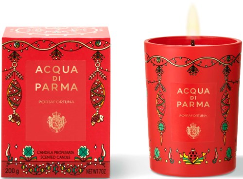 A red scented candle and box with Christmas decoration designs and the label 'Acqua di Parma,' 200g, 7oz.