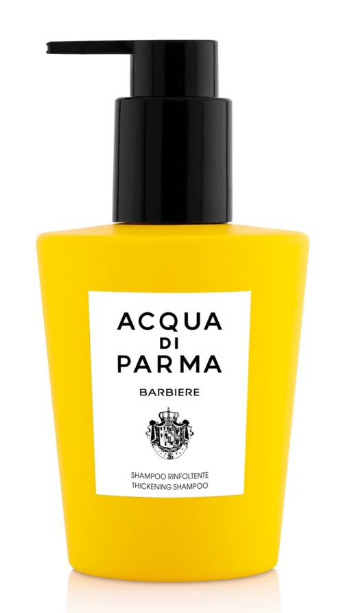 Gul flaska med svart pump, märkt 'Acqua di Parma' och 'Thickening Shampoo'.