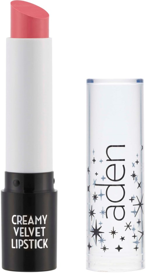 En rosa leppestift i en hvit og svart rør med merket "Creamy Velvet Lipstick", uten lokk. Lokk ved siden av har stjernesymboler.