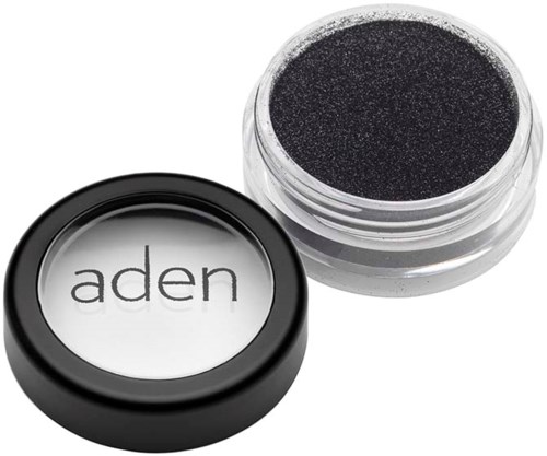 A small container of black eyeshadow with a lid that has the word "aden" on it.