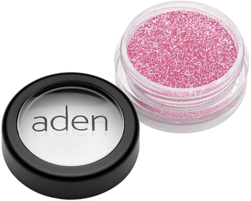 Rosa glitter skjønnhetsprodukt i liten beholder med svart lokk, merket "aden."