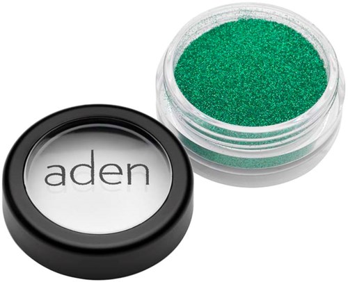 A small container of green glitter and a black and white container labeled "aden".
