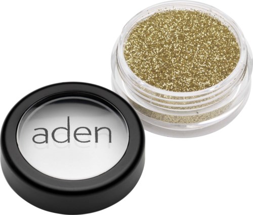 En liten beholder fylt med gullfarget glitter, og et lokk med ordet "aden" på.