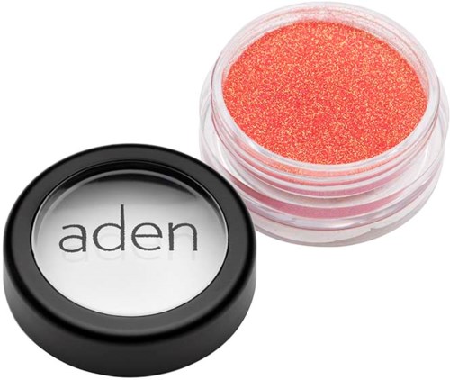 A small container of red cosmetic pigment with a black lid labeled "aden."