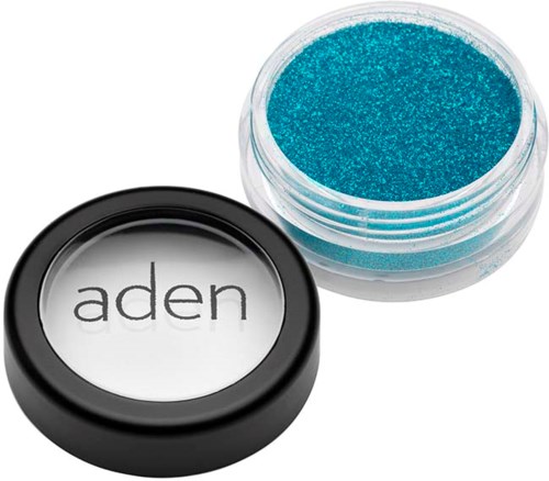 En liten åpen beholder med blå glitter og en rund svart lokk med ordet "aden".