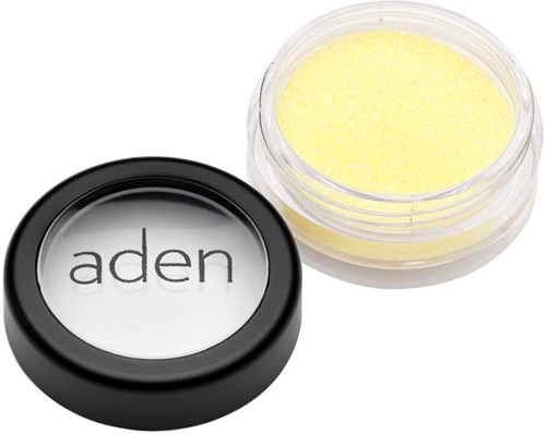 A small jar with yellow lip balm and a black lid labeled "aden".