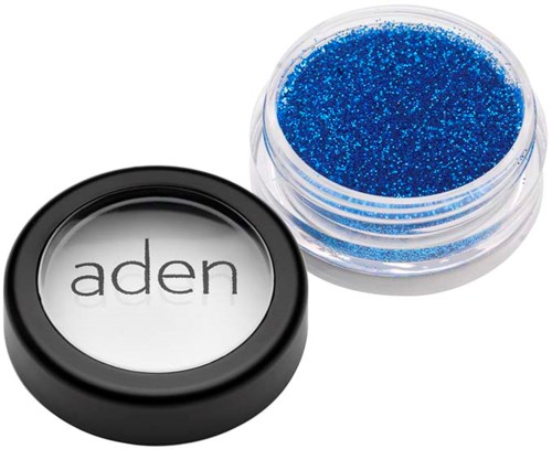 A small container with bright blue glitter and a separate lid with the word "aden" on it.
