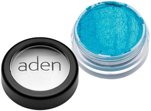 A small jar of bright blue pigment with its black lid beside it, labeled 'aden' on top.