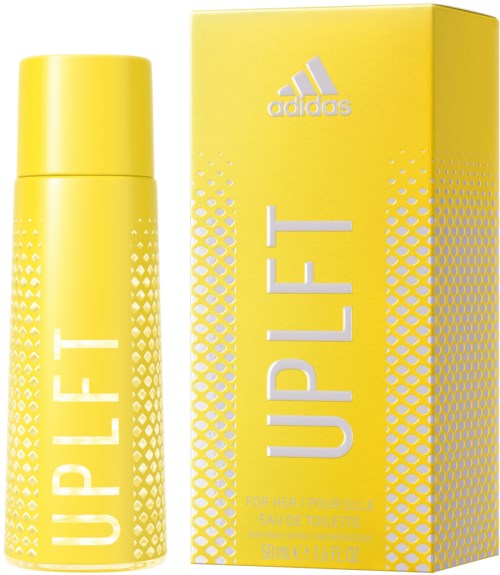 En gul Adidas UPLIFT deodorantsprayflaska bredvid sin matchande gula box med vitt text.