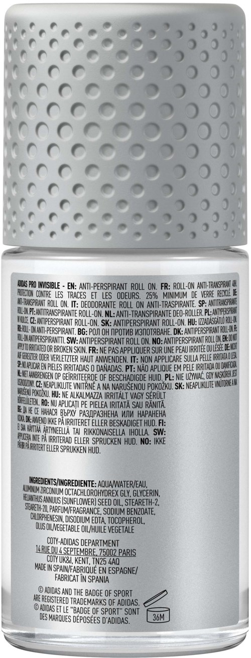 En vit sprayflaska med prickig topp och detaljerad textetikett på kroppen.
