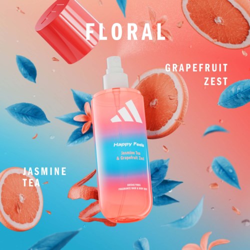 En blomsterdryckflaska märkt Happy Feels Jasmine Tea och Grapefruit Zest, omgiven av grapefruktskivor och blå blad.