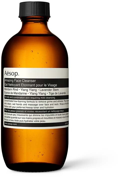 A brown bottle labeled Aesop Amazing Face Cleanser, used for mild skin cleansing with natural ingredients.