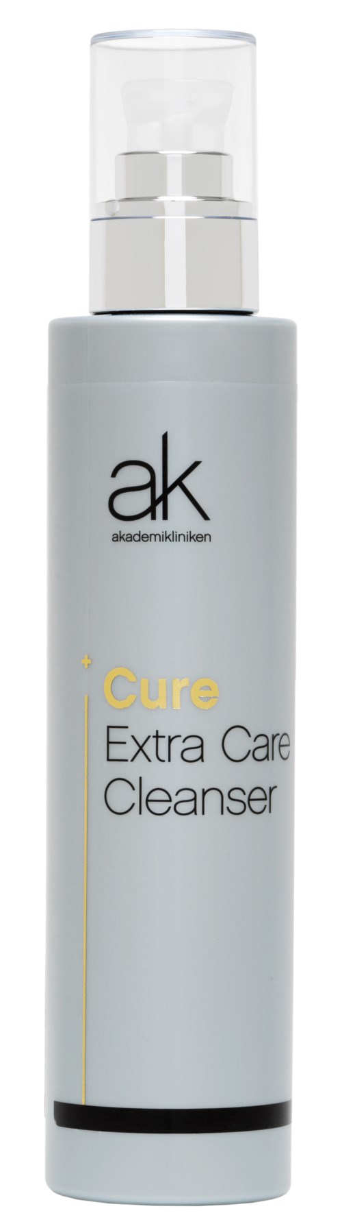 En lång, vit flaska med klar pump, märkt 'ak skincare' och 'Cure Extra Care Cleanser' för att tvätta huden.