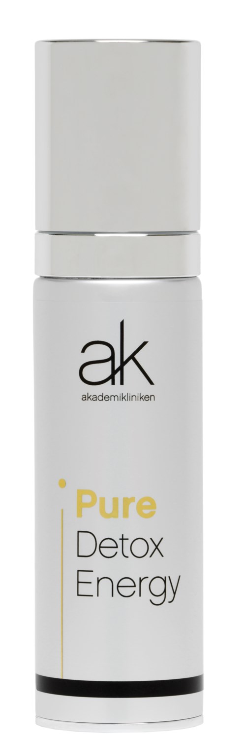En vit flaska med vit lock, märkt 'ak akademikliniken' och 'Pure Detox Energy' i svart och gult text.