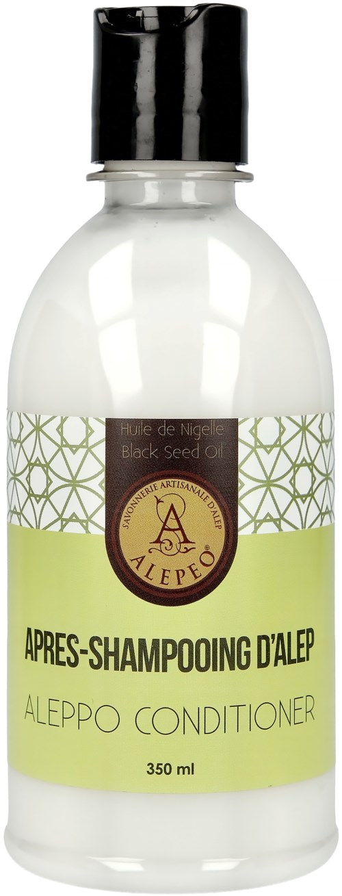 En vit flaska med svart lock, etiketten säger Aleppo-balsam, 350 ml, innehåller svartfröolja, används för hår.